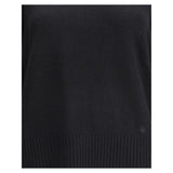 Close-up of Loulou De Saison Baltra cashmere sweater highlighting fine knit texture and ribbed hem in black, ideal for upscale women’s sweaters.