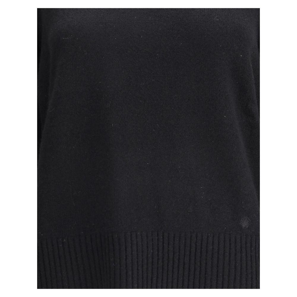 Close-up of Loulou De Saison Baltra cashmere sweater highlighting fine knit texture and ribbed hem in black, ideal for upscale women’s sweaters.