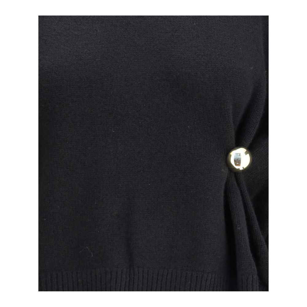 Detail view of Loulou De Saison Draped Sweater showing gold-tone pearl button and soft knit texture, emphasizing luxury craftsmanship.