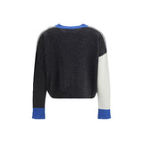 Back view of Marni Cropped Cardigan showcasing dark gray and white colorblock design with blue ribbed cuffs and collar. Stylish women's knitwear.
