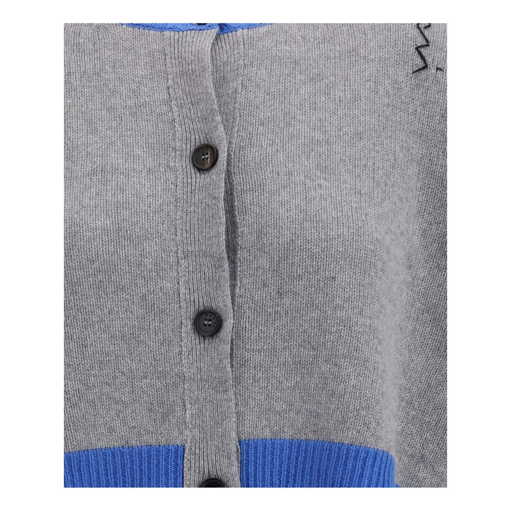 Close-up of Marni Cropped Cardigan front buttons and gray knit texture with blue ribbed trim. Premium women's fashion sweater detail.