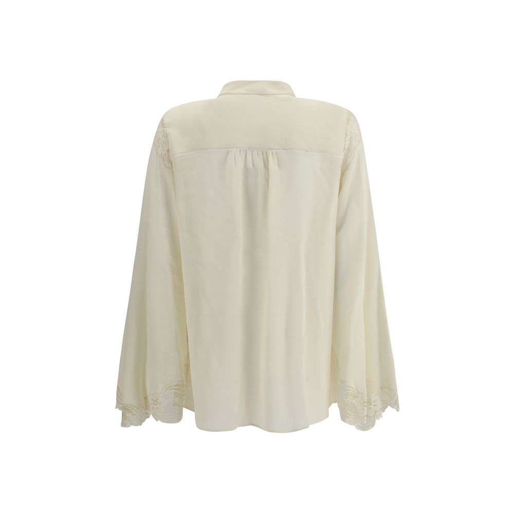 Back view of Chloé Silk georgette and lace blouse in cream, showcasing relaxed fit and delicate lace-trimmed sleeves for luxury women's wear.