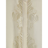Close-up of Chloé Silk georgette and lace blouse detailing, highlighting floral lace embroidery and fine craftsmanship in premium women's clothing.