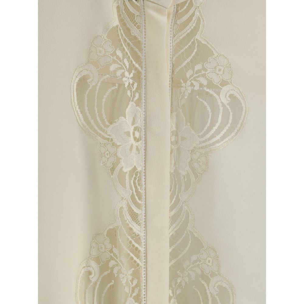 Close-up of Chloé Silk georgette and lace blouse detailing, highlighting floral lace embroidery and fine craftsmanship in premium women's clothing.