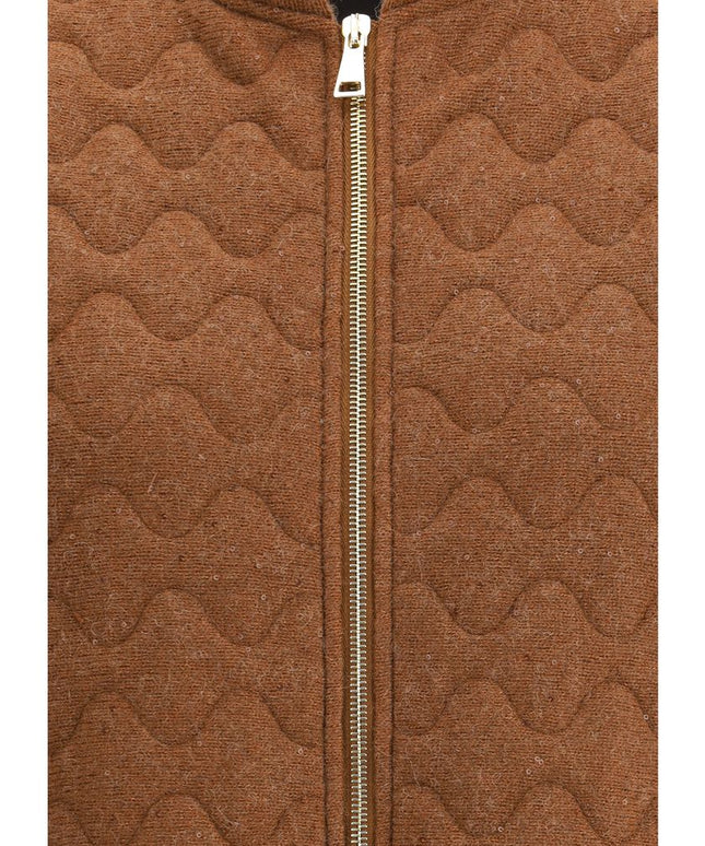 Close-up of Fabiana Filippi Wool Down Vest zipper and textured wool fabric, highlighting premium stitching and wave-quilted detail.