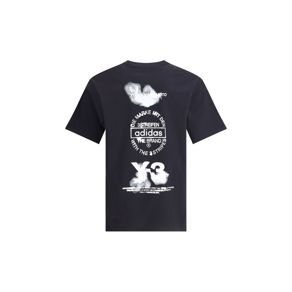 Back view of Y-3 T-Shirt with maxi print featuring bold Adidas and Y-3 branding. Black cotton tee for men, part of designer clothing collection.