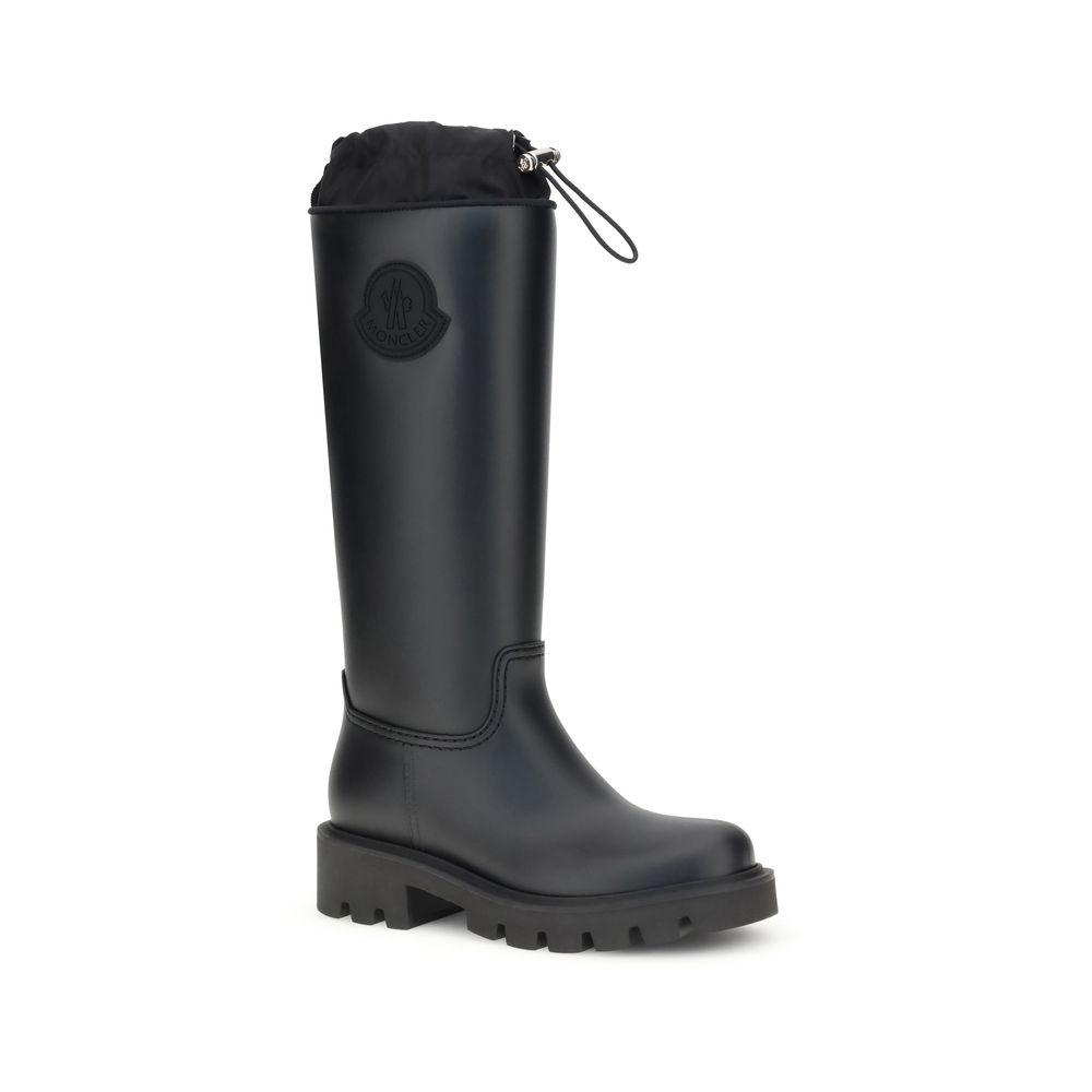 Side view of Moncler Kickstream High rain Boots featuring rugged sole and sleek waterproof design, perfect for stylish rain protection.