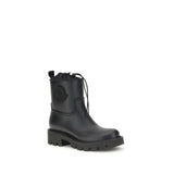 Side angle of Moncler Kickstream rubber boots featuring rugged sole, black finish, and signature logo, ideal for women's fall footwear.