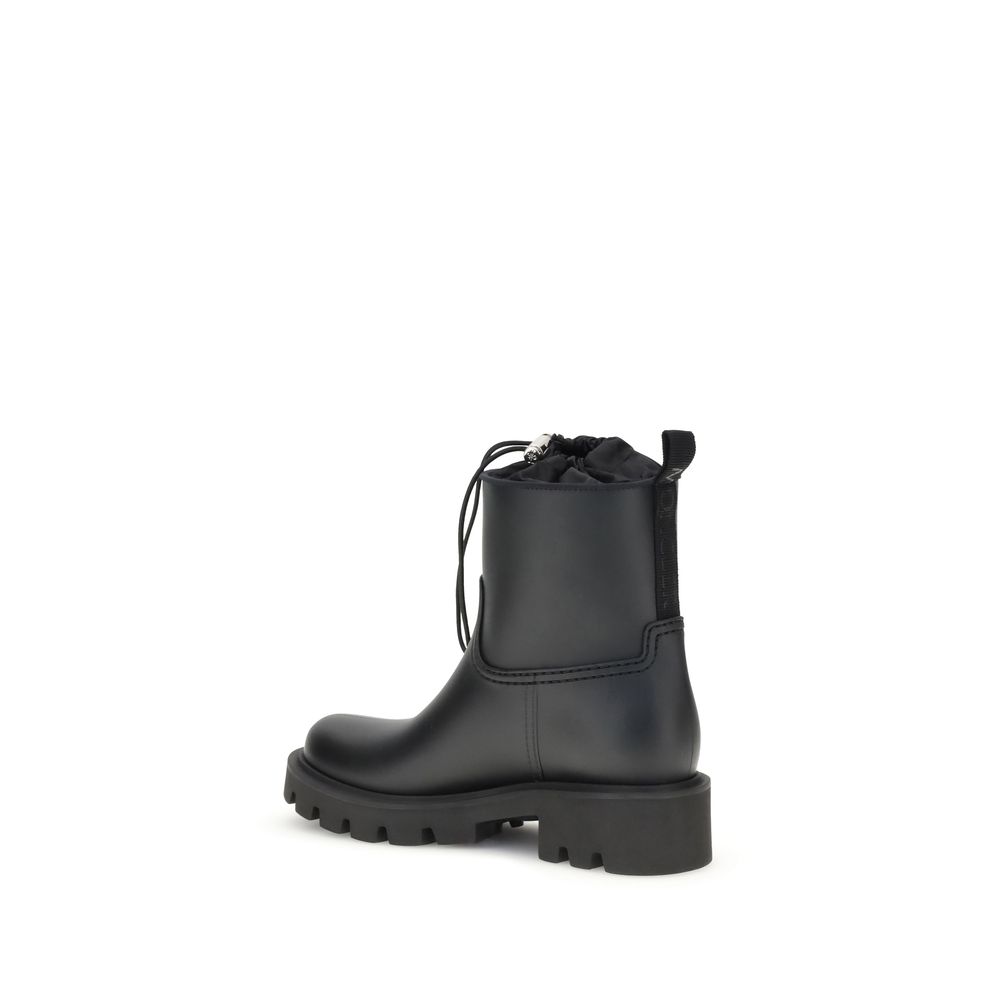 Rear view of Moncler Kickstream rubber boots showing pull tab and ankle-high design, durable and stylish for women's outdoor wear.