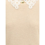 Close-up of Fabiana Filippi Lace collar Sweater showing intricate white lace collar and gold button, highlighting luxury knitwear details.