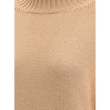 Close-up of Fabiana Filippi wool turtleneck sweater fabric texture in beige, highlighting fine knit quality and ribbed neckline.