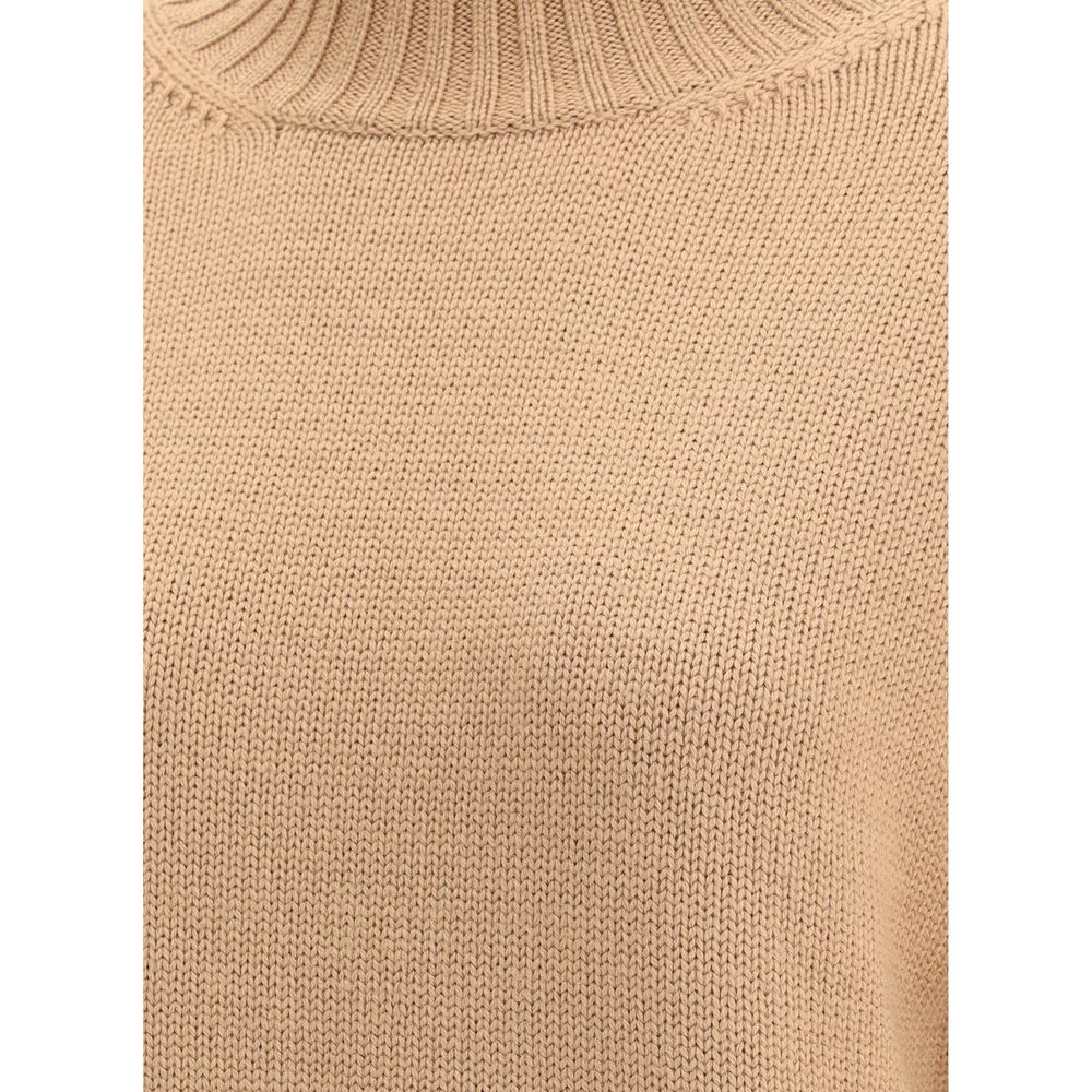 Close-up of Fabiana Filippi wool turtleneck sweater fabric texture in beige, highlighting fine knit quality and ribbed neckline.