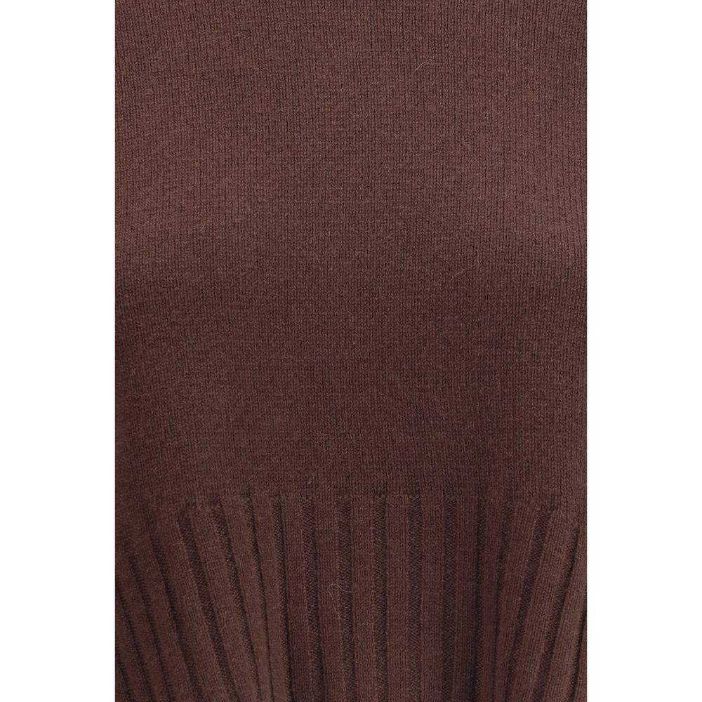 Close-up of Loulou De Saison Cashmere Crop Sweater fabric texture in brown, highlighting soft cashmere knit and ribbed waistband detail.