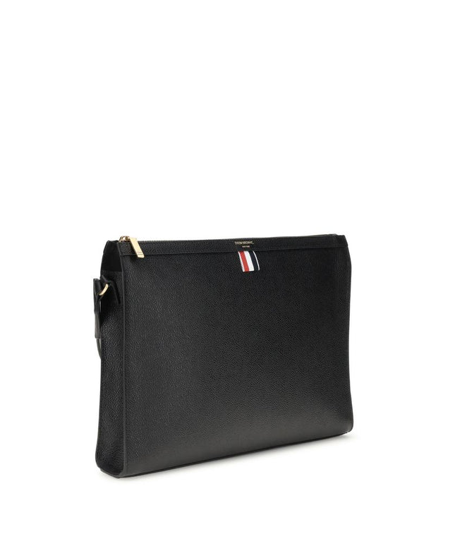 Angled view of Thom Browne Shoulder strap Pouch featuring sleek black leather and detachable strap, perfect for stylish men's accessories.