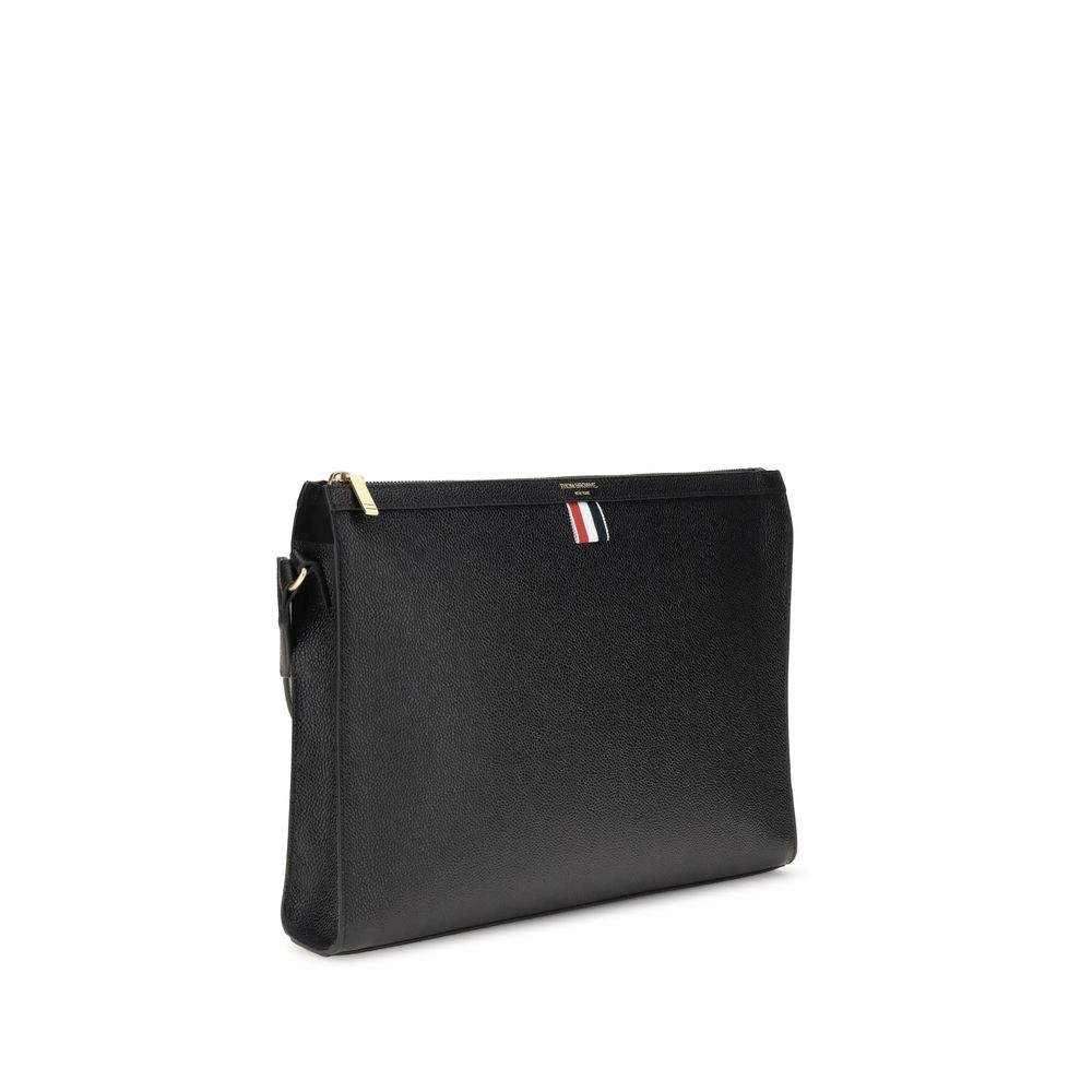Angled view of Thom Browne Shoulder strap Pouch featuring sleek black leather and detachable strap, perfect for stylish men's accessories.