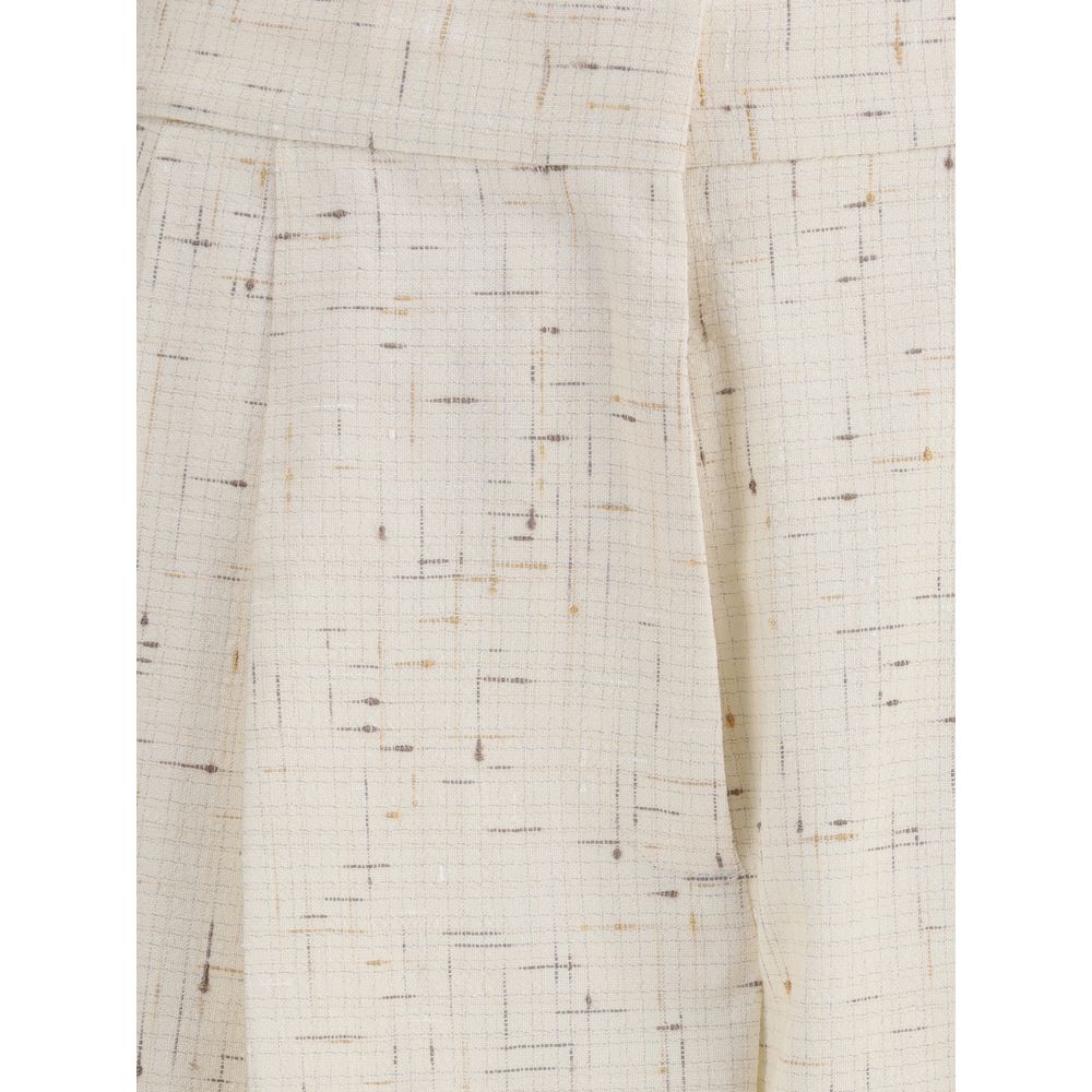 Close-up of Fabiana Filippi Buttoned fabric Pants highlighting the cream fabric's fine grid texture and abstract linear pattern.