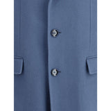Close-up of Brioni Chesterfield Coat buttons and flap pocket detail, highlighting premium craftsmanship and elegant wool fabric texture.