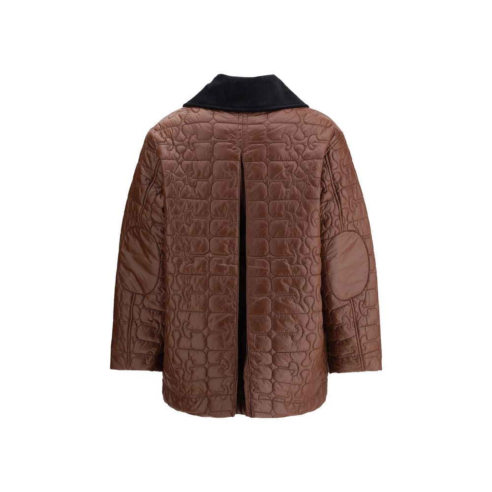 Back view of Ganni Shiny Quilt Midi Jacket showing quilted pattern, elbow patches, and pleated detail. Stylish and functional women's jacket.