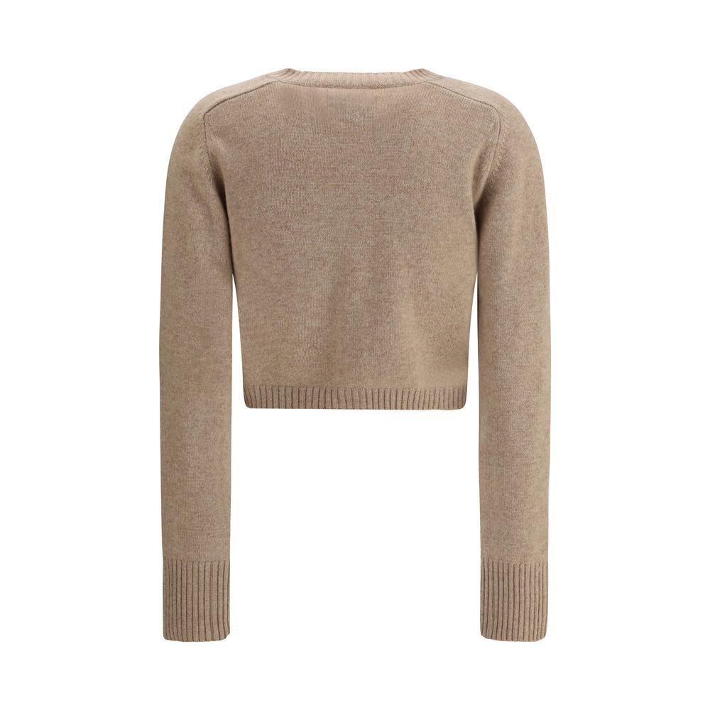 Back view of Loulou De Saison Cashmere crop Cardigan in beige, showcasing cropped hem and soft knit texture for stylish layering.