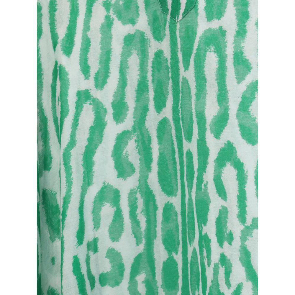 Close-up of Tom Ford Kaftan Dress fabric highlighting green abstract animal print on lightweight material for a chic, breezy look.