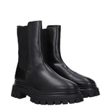 Pair of Stuart Weitzman Black Leather Ankle Boots featuring sleek leather finish and thick treaded sole for stylish durability.