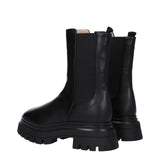 Rear angle of Stuart Weitzman Black Leather Ankle Boots highlighting pull tabs and embossed SW branding on the heel.