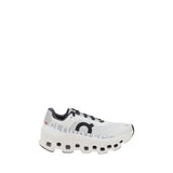 ON Cloudmonster Sneakers in white with bold CloudTec sole and black logo, women's athletic running shoes in EU36.5/US6.5 size.