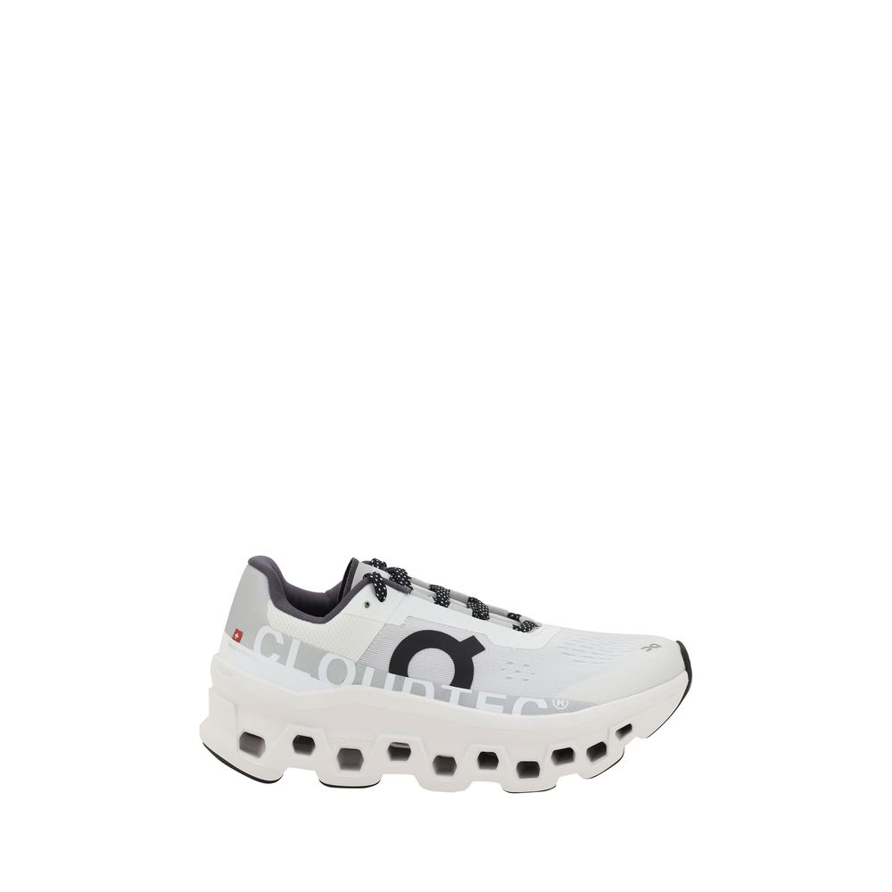 ON Cloudmonster Sneakers in white with bold CloudTec sole and black logo, women's athletic running shoes in EU36.5/US6.5 size.