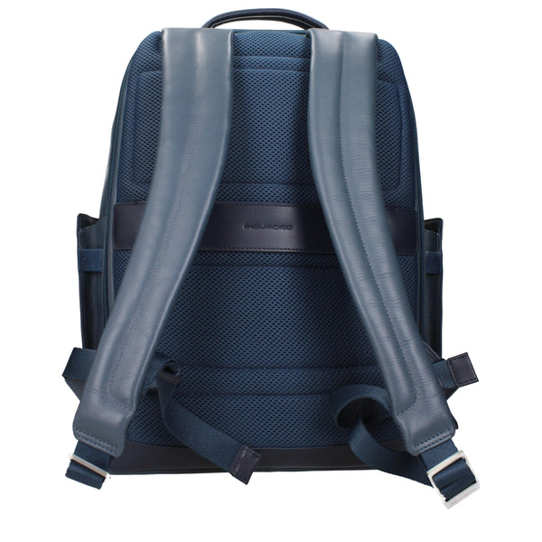Back view of Piquadro Blue Leather Backpack featuring padded straps and breathable mesh panel for comfortable wear.
