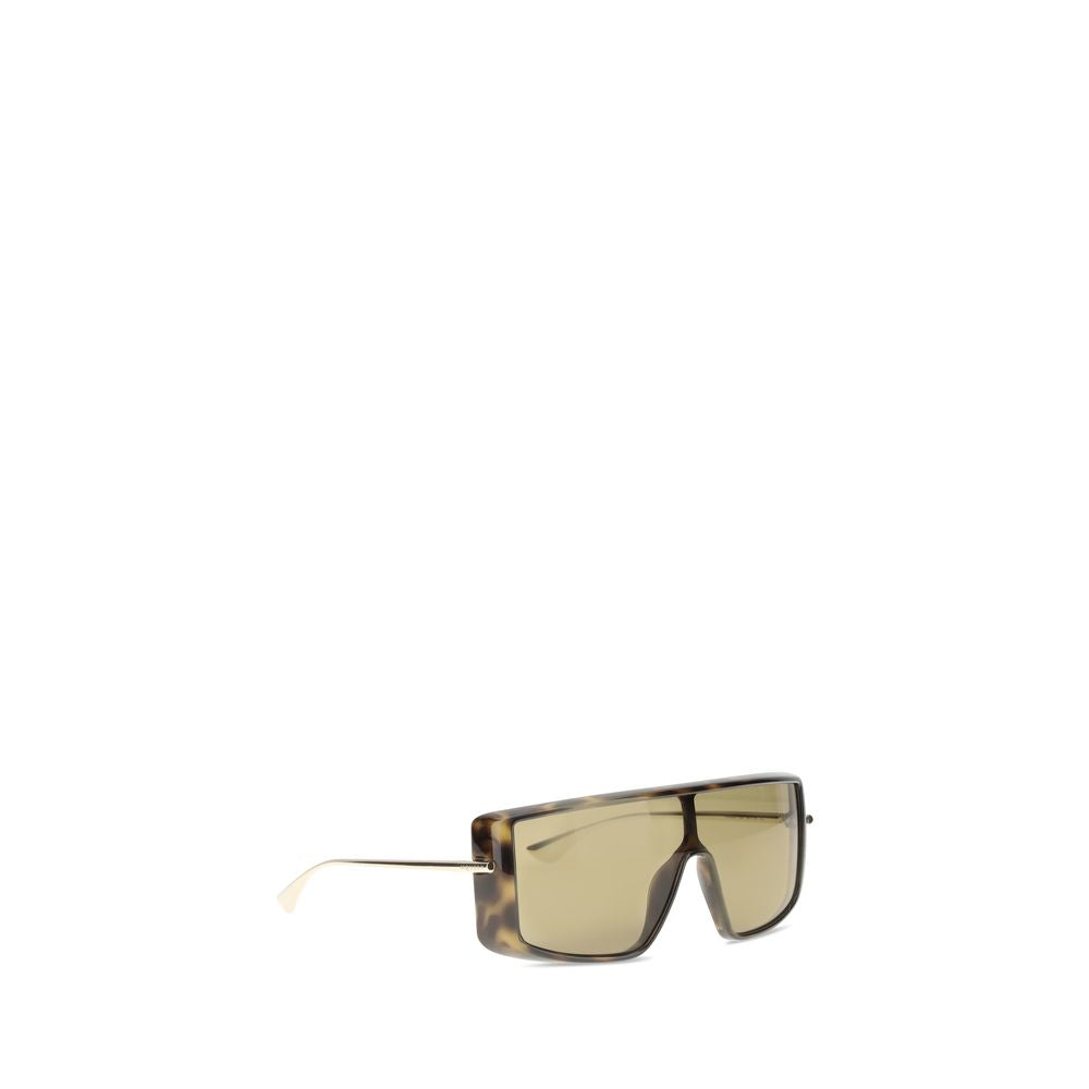 Side angle of Alexander McQueen Havana T-Bar Visor Sunglasses showing tortoiseshell frame and sleek gold-tone temples in women's designer eyewear.