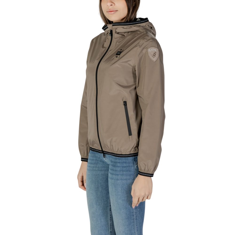 Blauer green polyamide hooded jacket for women, side angle view highlighting zip pockets and logo patch on sleeve.
