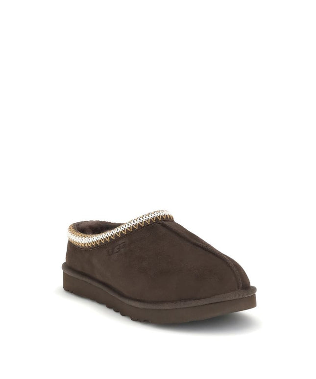 Men's UGG Tasman II Mules in brown, angled front view highlighting soft suede upper and embroidered collar trim.