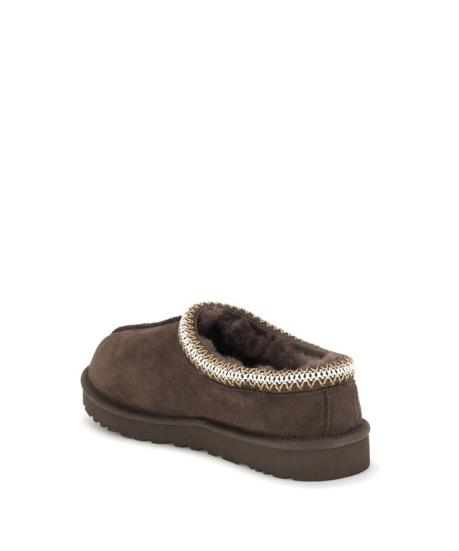 Rear angle of UGG Tasman II Mules in brown, showcasing durable sole and cozy interior lining for men's casual footwear.