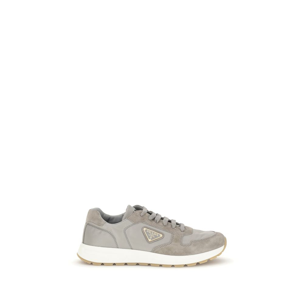 Prada Prax 01 re-nylon sneakers in gray with suede and nylon upper, low-top design, and white rubber sole, men's EU 38.5 to EU 42 sizes.