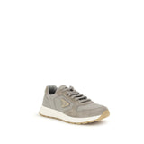 Gray Prada Prax 01 re-nylon sneakers featuring side logo triangle, lace-up front, and cushioned sole for athletic and casual wear.