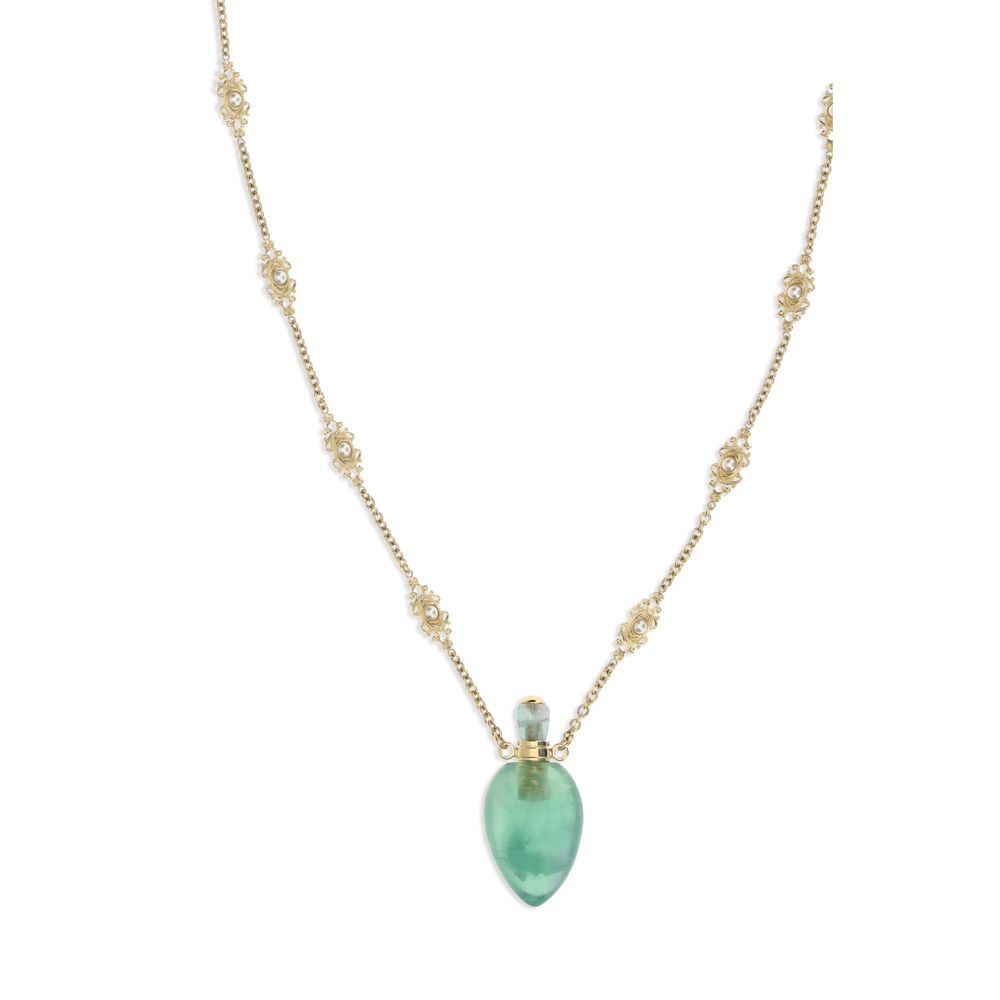 Close-up of Chloé Elixir Pendant Necklace showcasing ornate gold chain links and a translucent green pendant, ideal for luxury fashion styling.