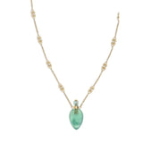 Close-up of Chloé Elixir Pendant Necklace showcasing ornate gold chain links and a translucent green pendant, ideal for luxury fashion styling.