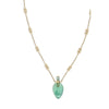 Close-up of Chloé Elixir Pendant Necklace showcasing ornate gold chain links and a translucent green pendant, ideal for luxury fashion styling.