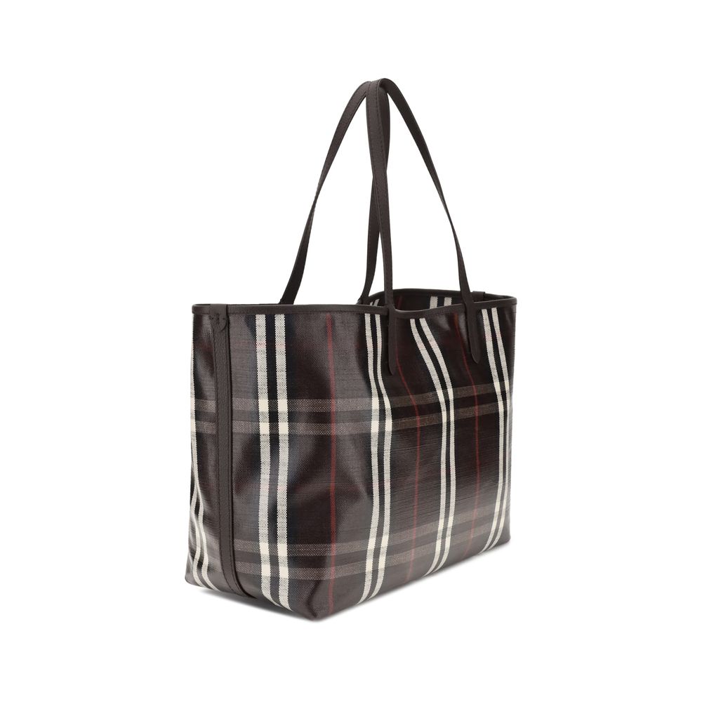 Angled rear view of Burberry Medium Highlands Tote Bag highlighting structured silhouette and iconic Burberry check design.