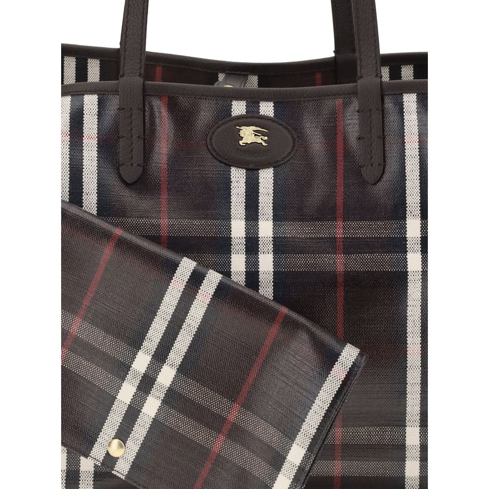 Close-up of Burberry Medium Highlands Tote Bag featuring logo detail and matching detachable pouch in classic plaid print.