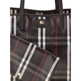 Close-up of Burberry Medium Highlands Tote Bag featuring logo detail and matching detachable pouch in classic plaid print.