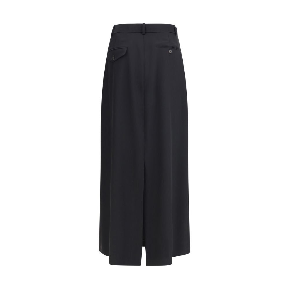 Back view of The Row Seraphyne virgin wool skirt featuring buttoned welt pockets and a center slit. Perfect long skirt for timeless fall fashion.