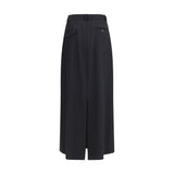 Back view of The Row Seraphyne virgin wool skirt featuring buttoned welt pockets and a center slit. Perfect long skirt for timeless fall fashion.