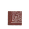 Destin Bandana Scarf in red with white paisley print, neatly folded to showcase its square shape and intricate border design.