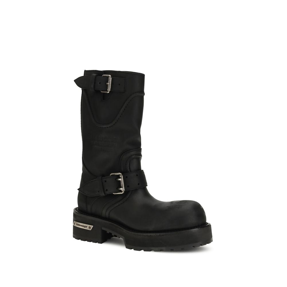Side angle of Balenciaga Venom Boots showcasing rugged lace-free design, silver-tone hardware, and embossed branding.