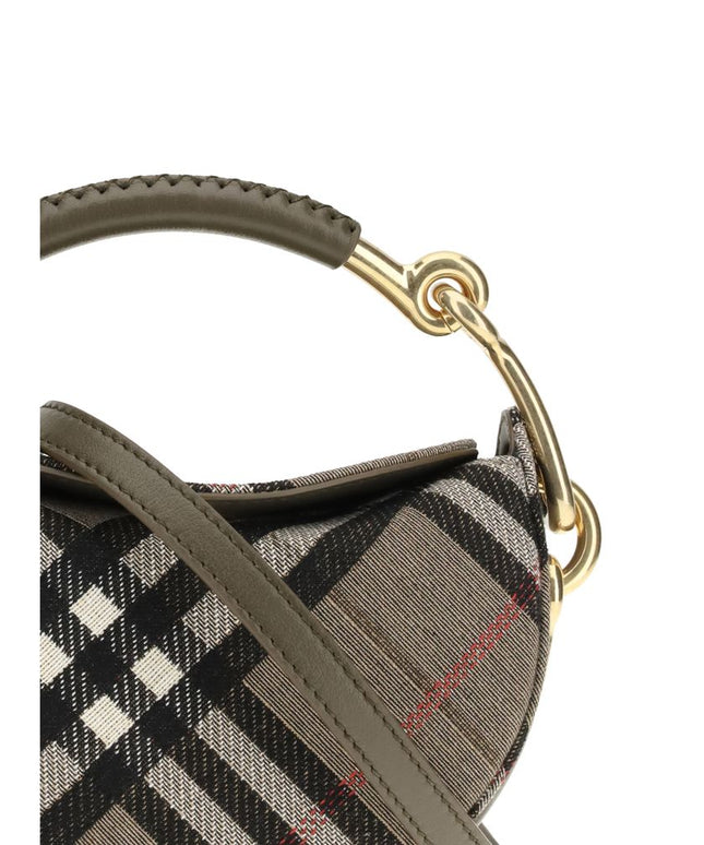 Close-up of Burberry Brindle Clutch Bag handle and stitching, featuring olive leather grip and polished gold accents for a refined designer finish.