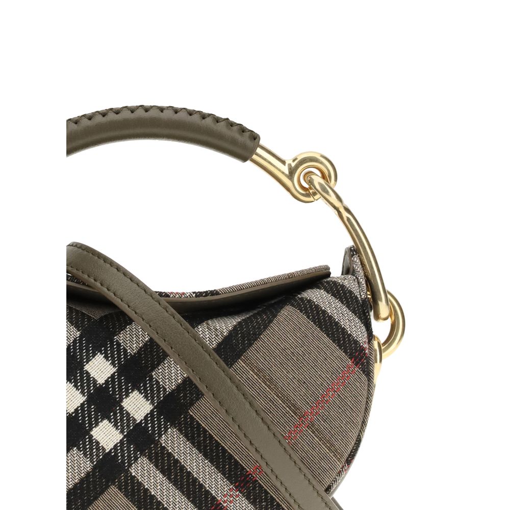 Close-up of Burberry Brindle Clutch Bag handle and stitching, featuring olive leather grip and polished gold accents for a refined designer finish.