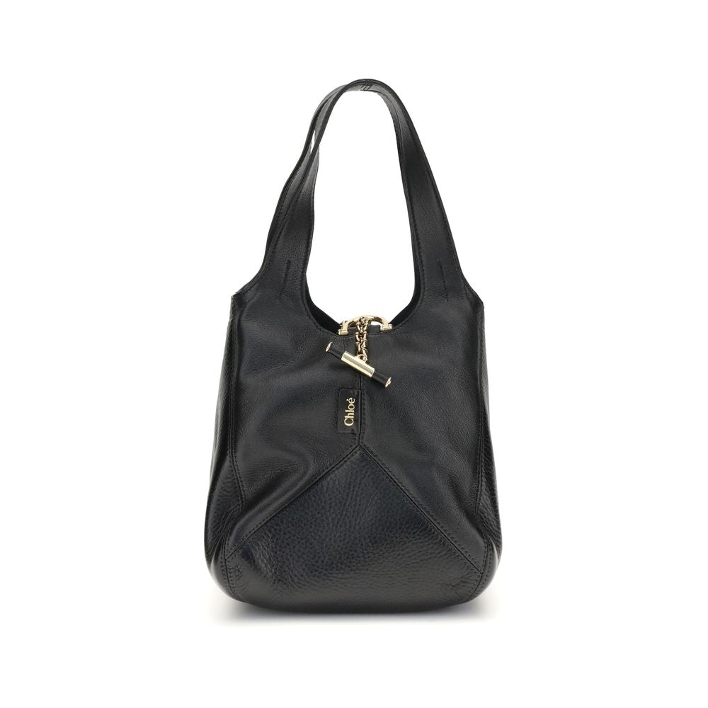 Chloé Small Balloon Shoulder Bag in black leather with gold-tone hardware and dual handles, ideal for women's luxury fashion.