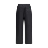 Back view of Gucci Cotton Pants in black featuring flap pocket with button closure and signature Gucci stripe detail above the pocket.