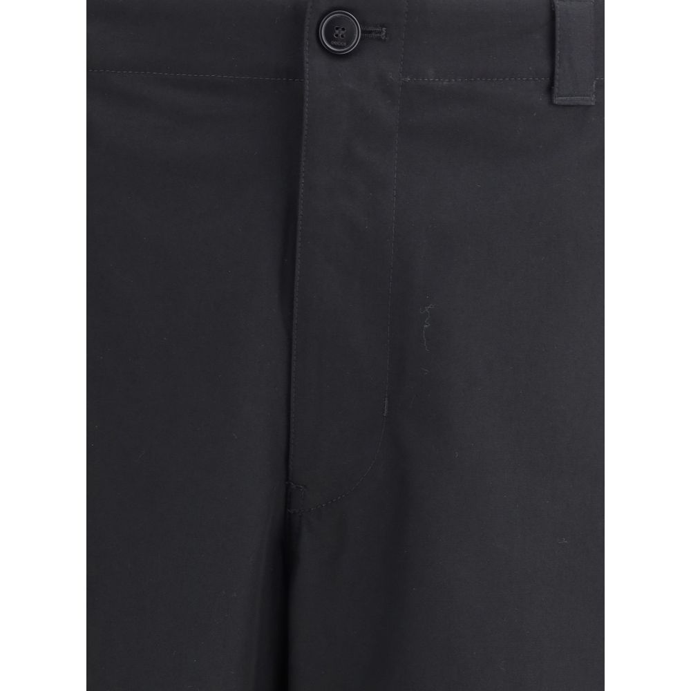 Close-up of Gucci Cotton Pants waistband and button closure, highlighting fine stitching and premium cotton fabric in black.